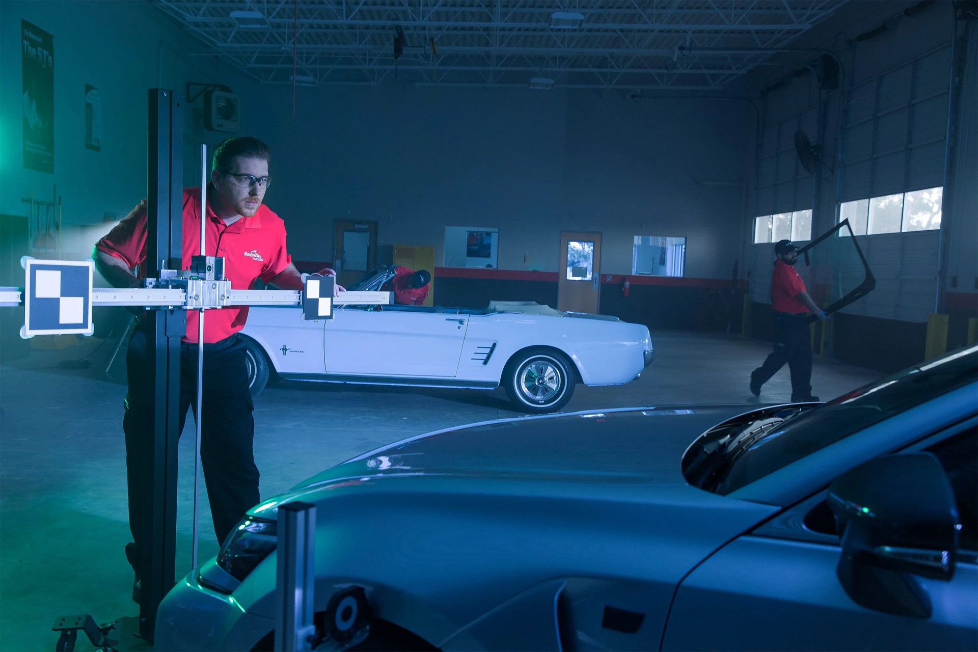 man looking at car with light
