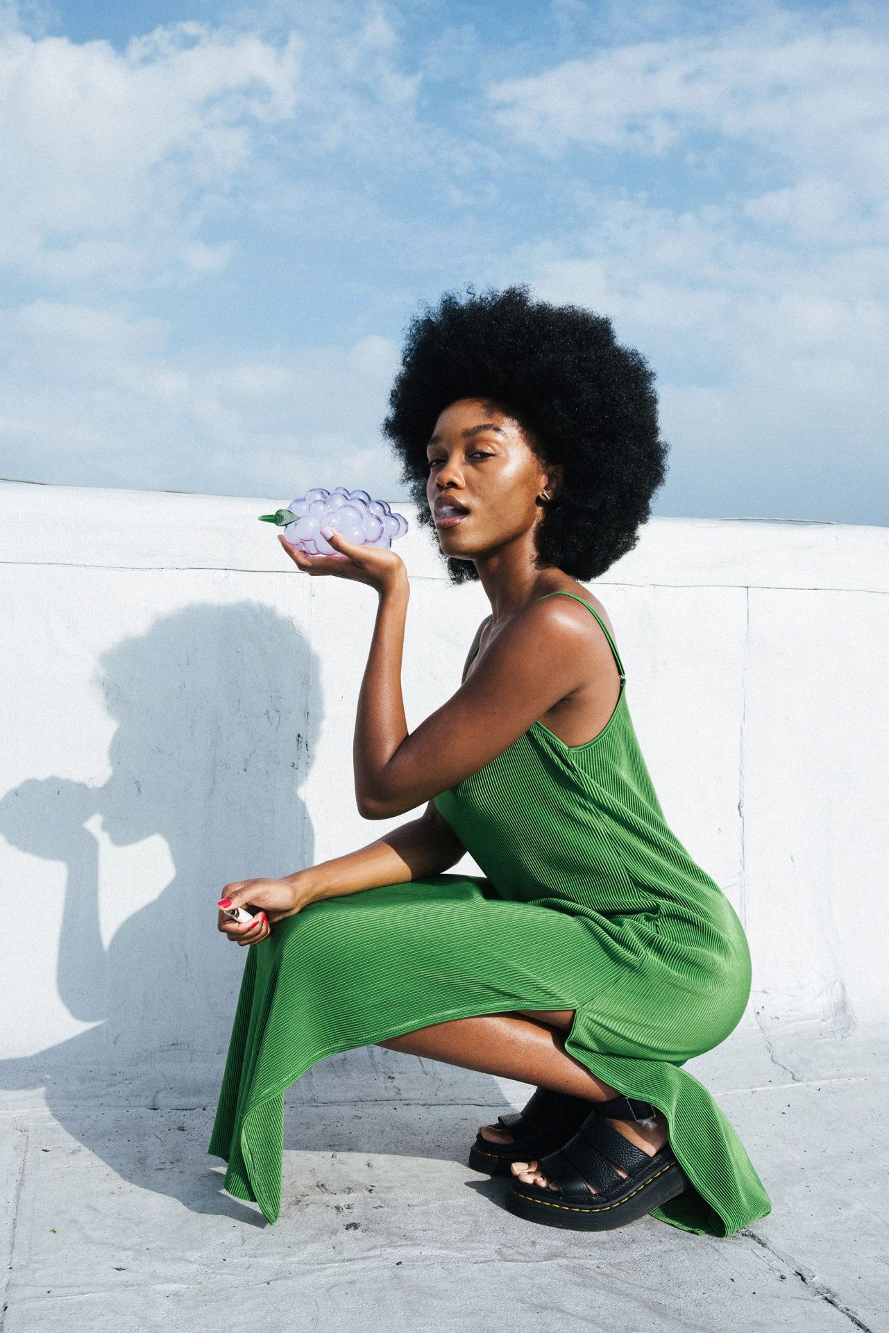 woman smoking from fruit bong