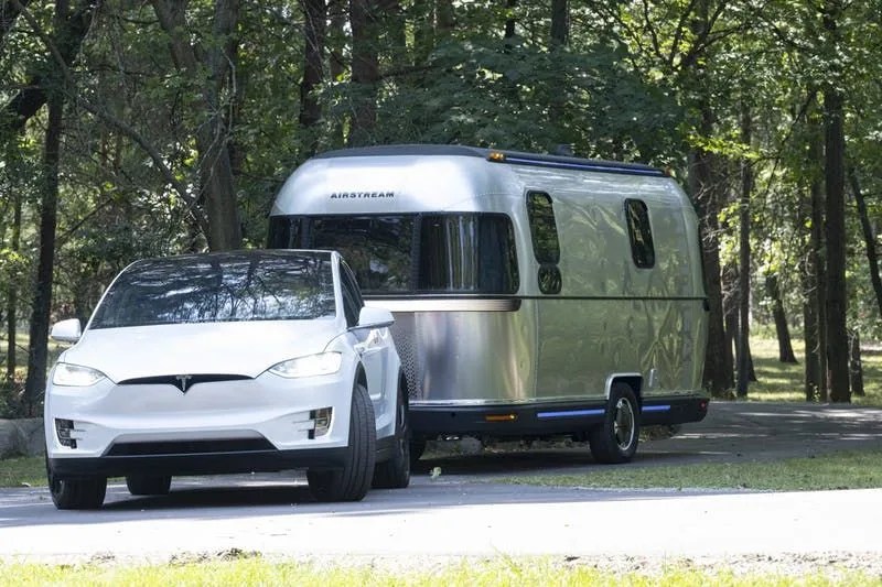 airstream electric trailer towed by a tesla