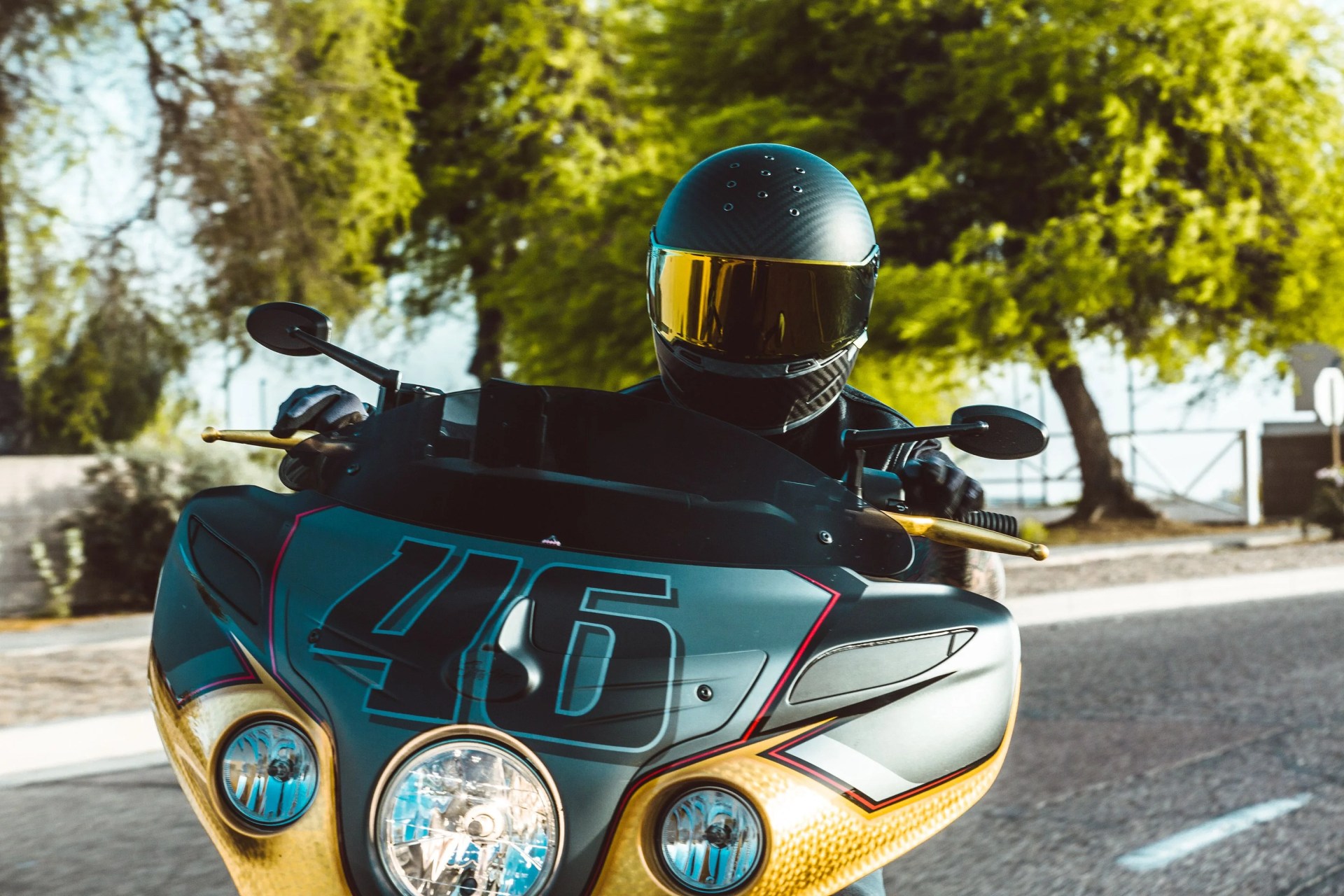 bell eliminator carbon helmet worn by person on motorcycle