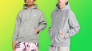 one person wearing nike grey hoodie and one person wearing champion grey hoodie