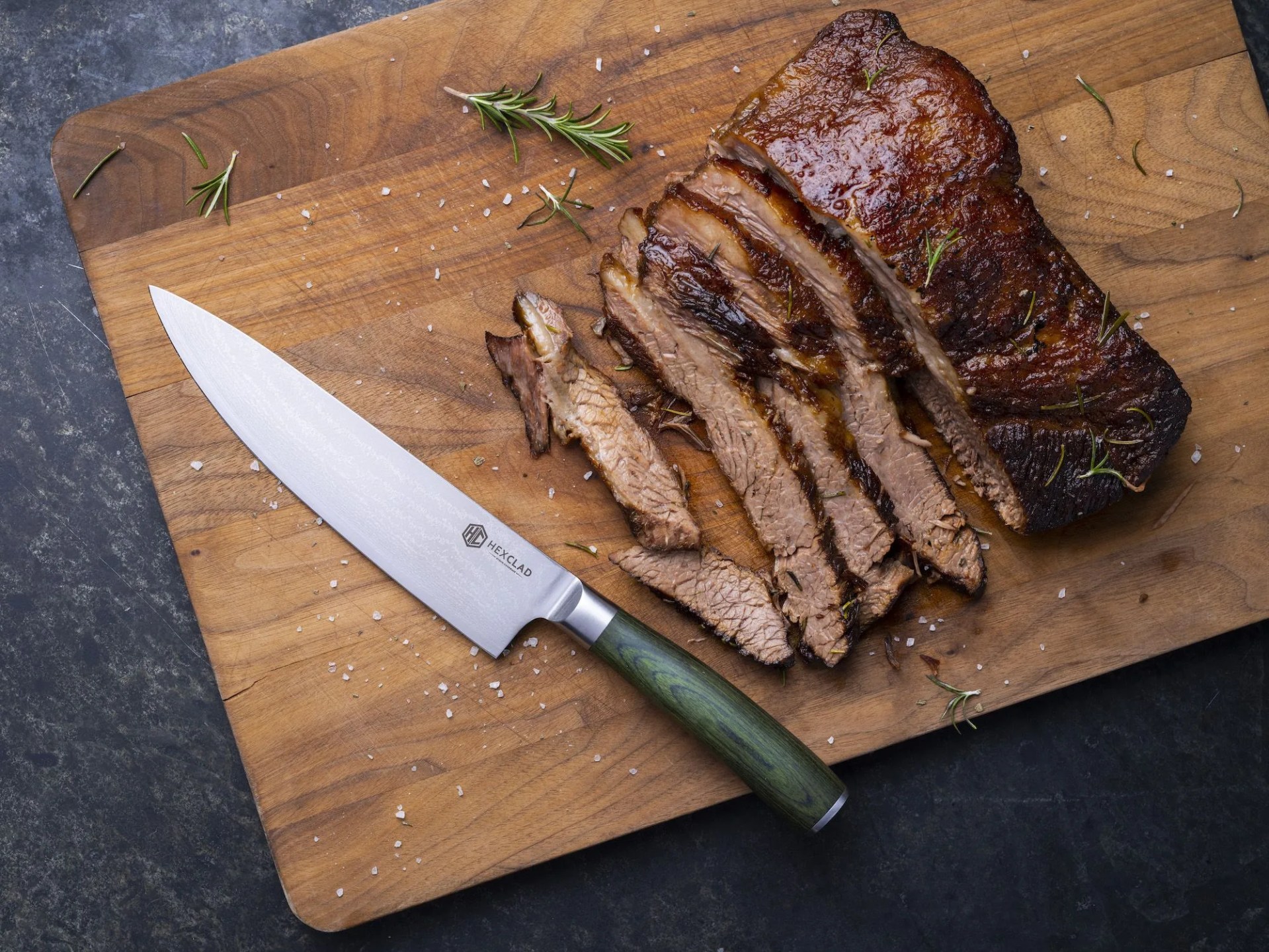 hexclad knife next to sliced brisket