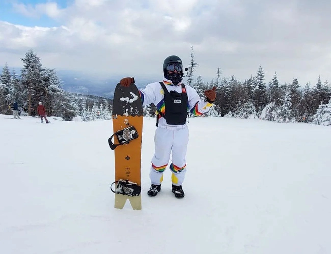 steve holding powder board in snow