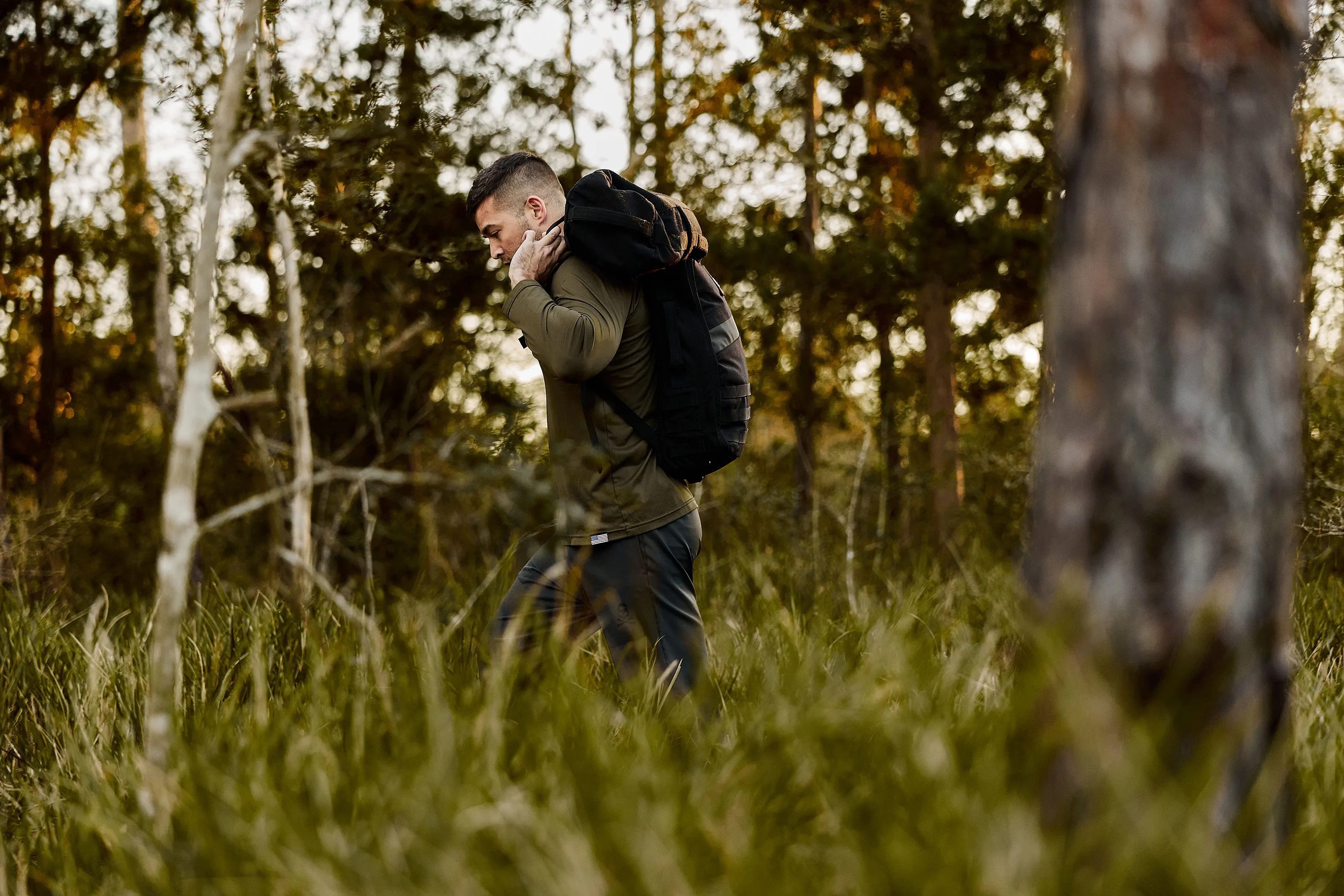 man carrying goruck bag