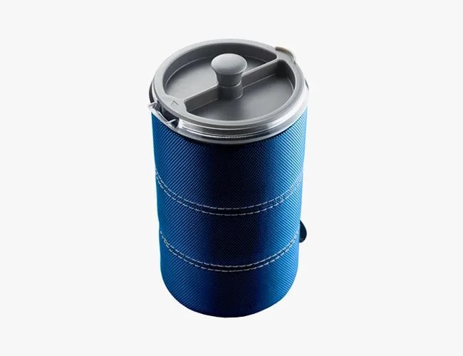 a blue french press for camping