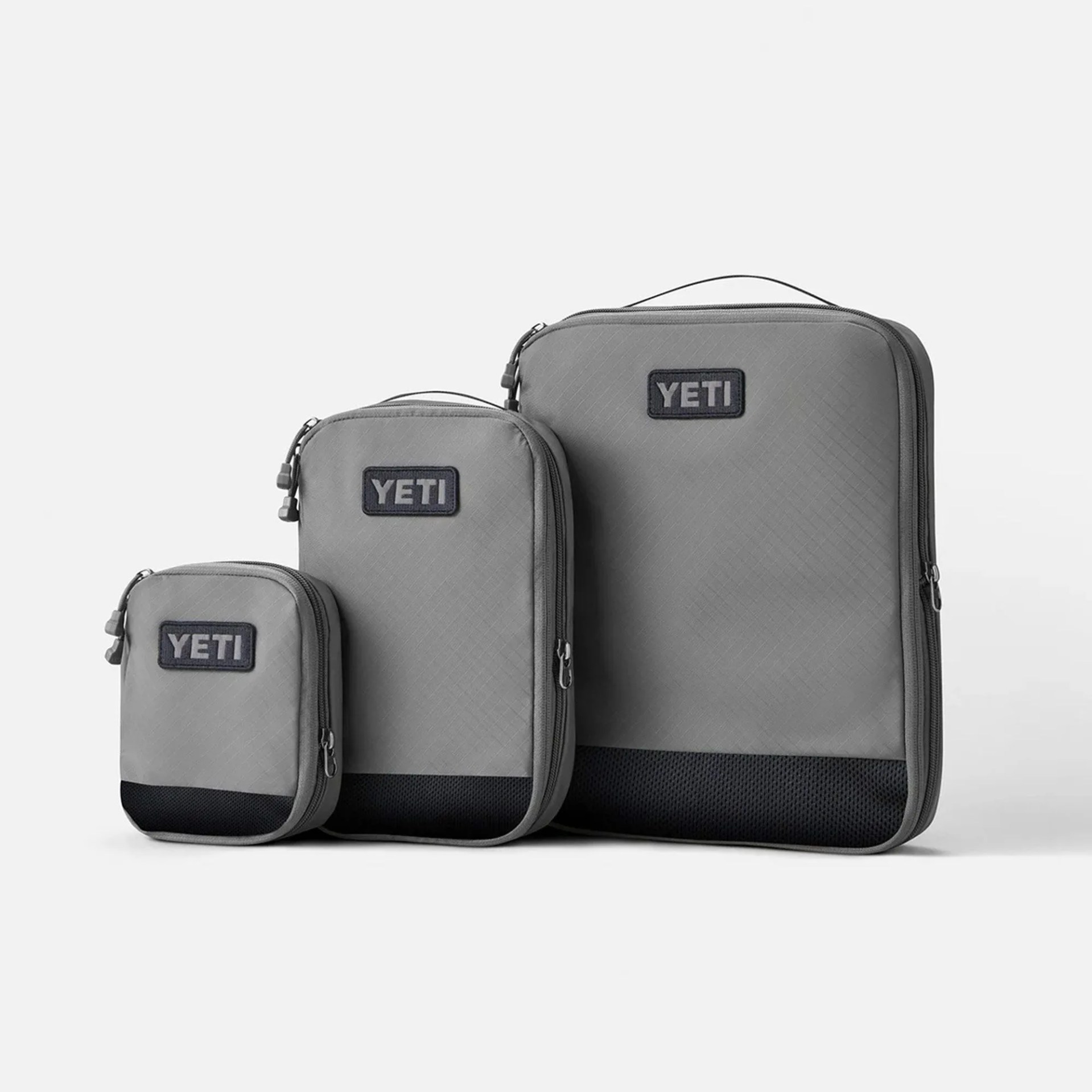 a set of gray packing cubes