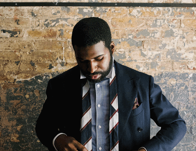 amechi tying his tie
