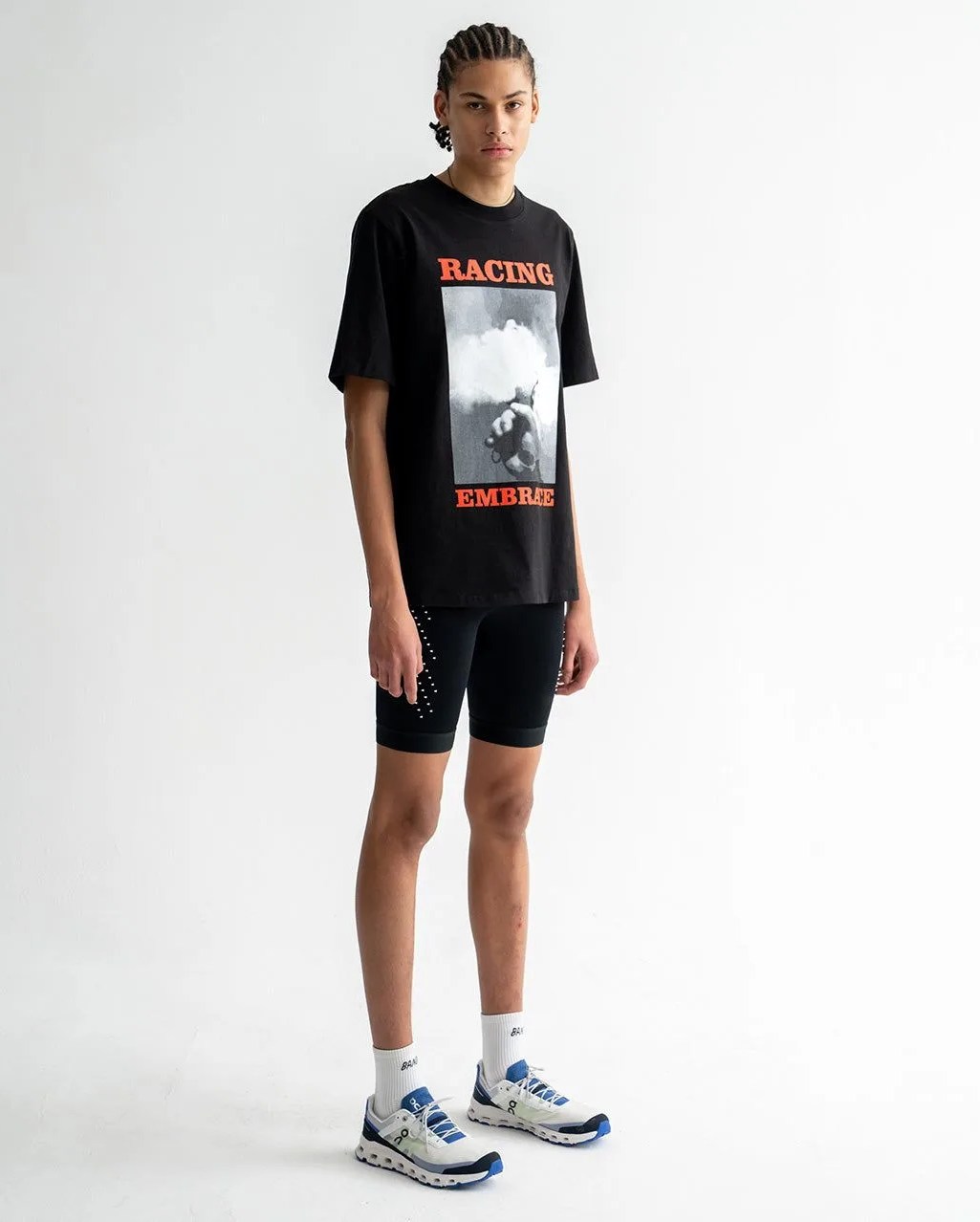 man wearing forrest racing embrace logo tee
