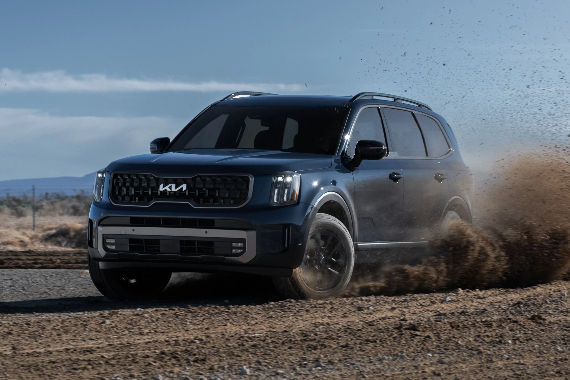 kia telluride power sliding through dirt