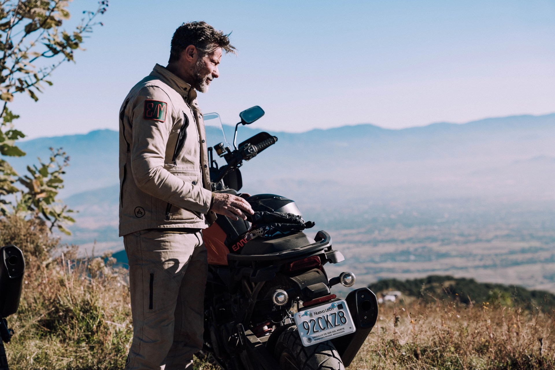 man standing next to bike