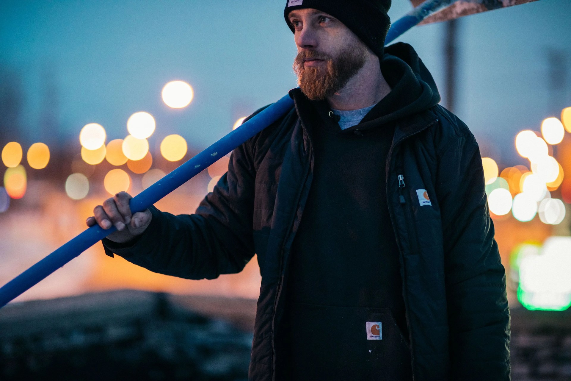 man wearing carhartt rain jacket