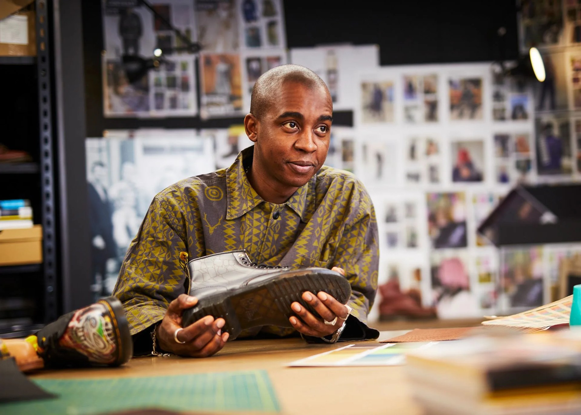 darren mckoy holding a dr martens boot