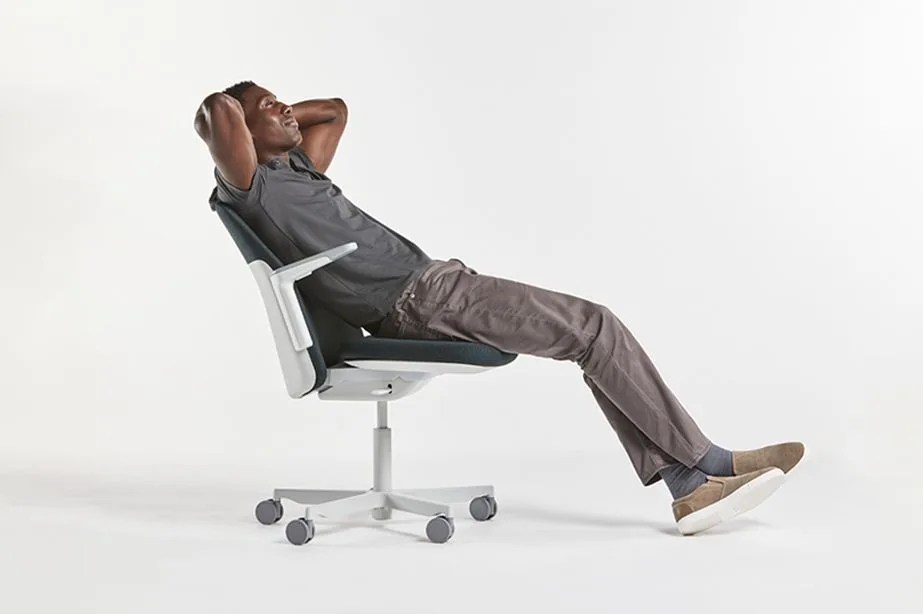 man reclining in an office chair