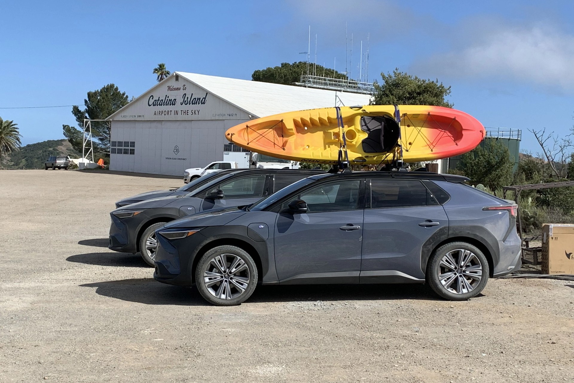 subaru solterra at catalina island airport with a kayak on the roof