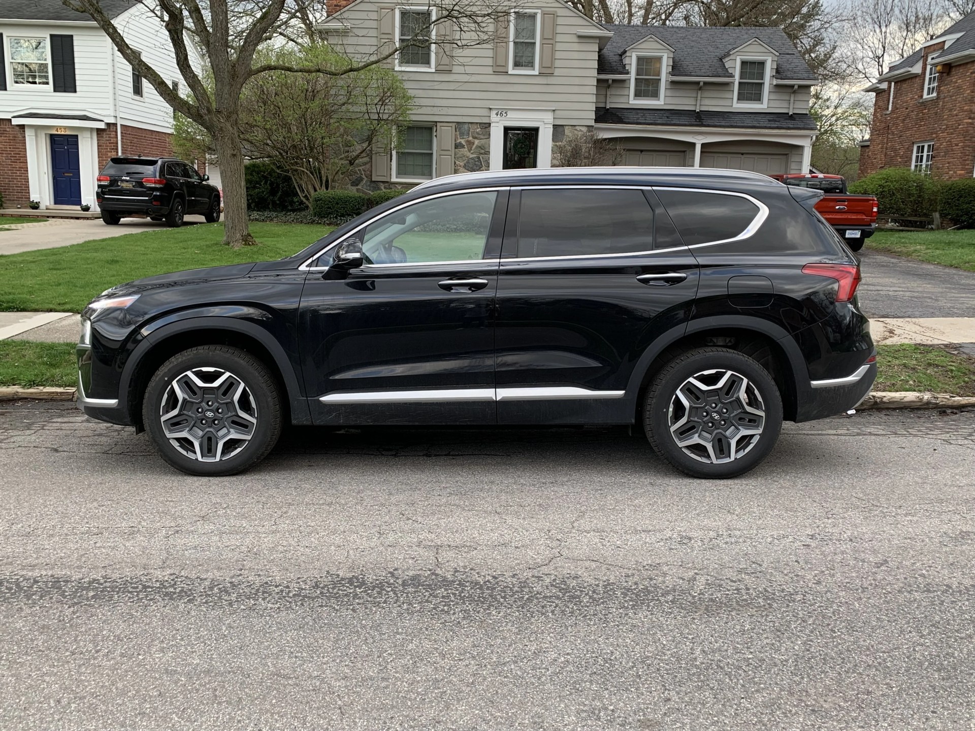 hyundai santa fe hybrid parked on a suburban street
