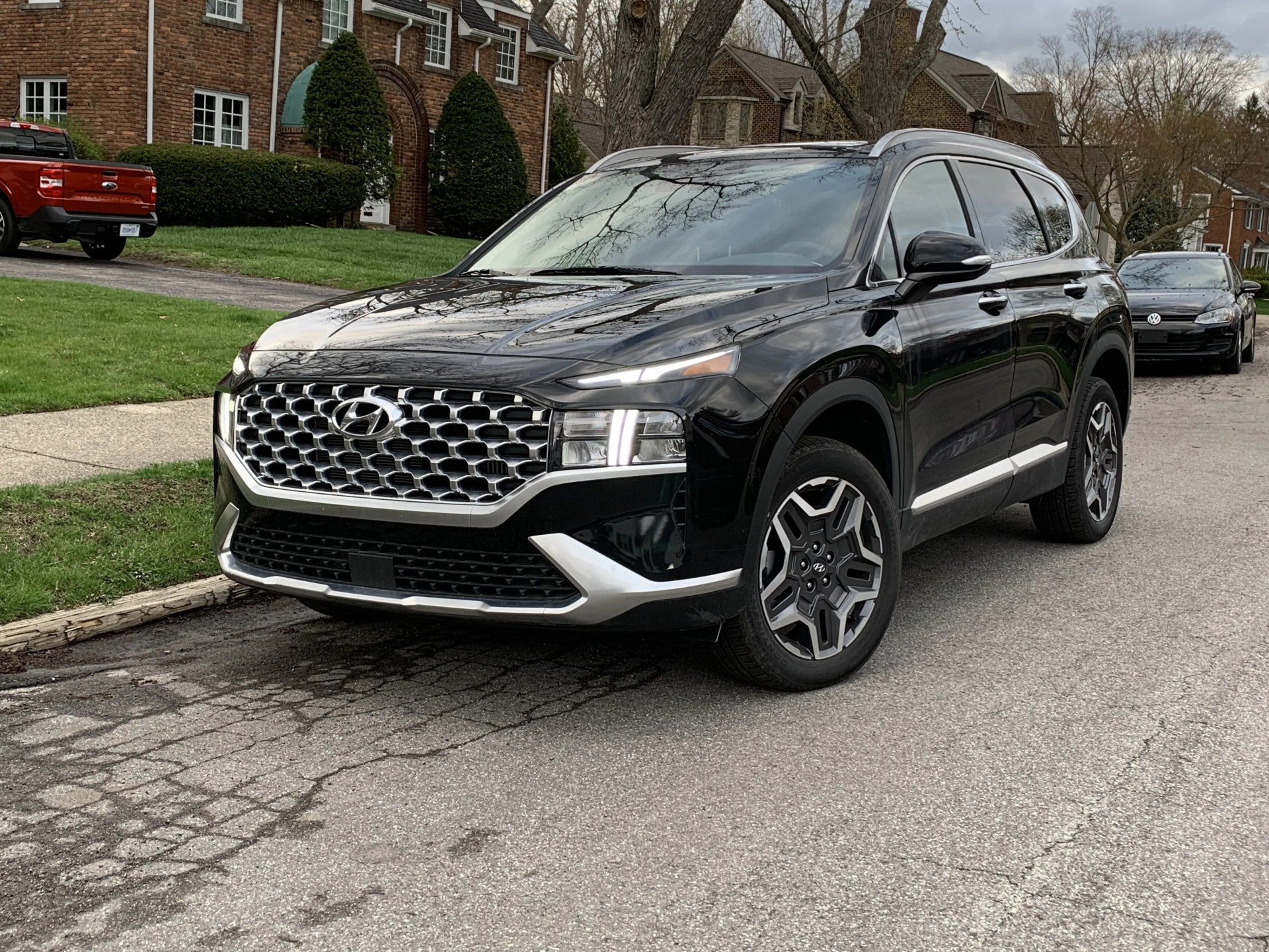 hyundai santa fe hybrid parked on side of the street