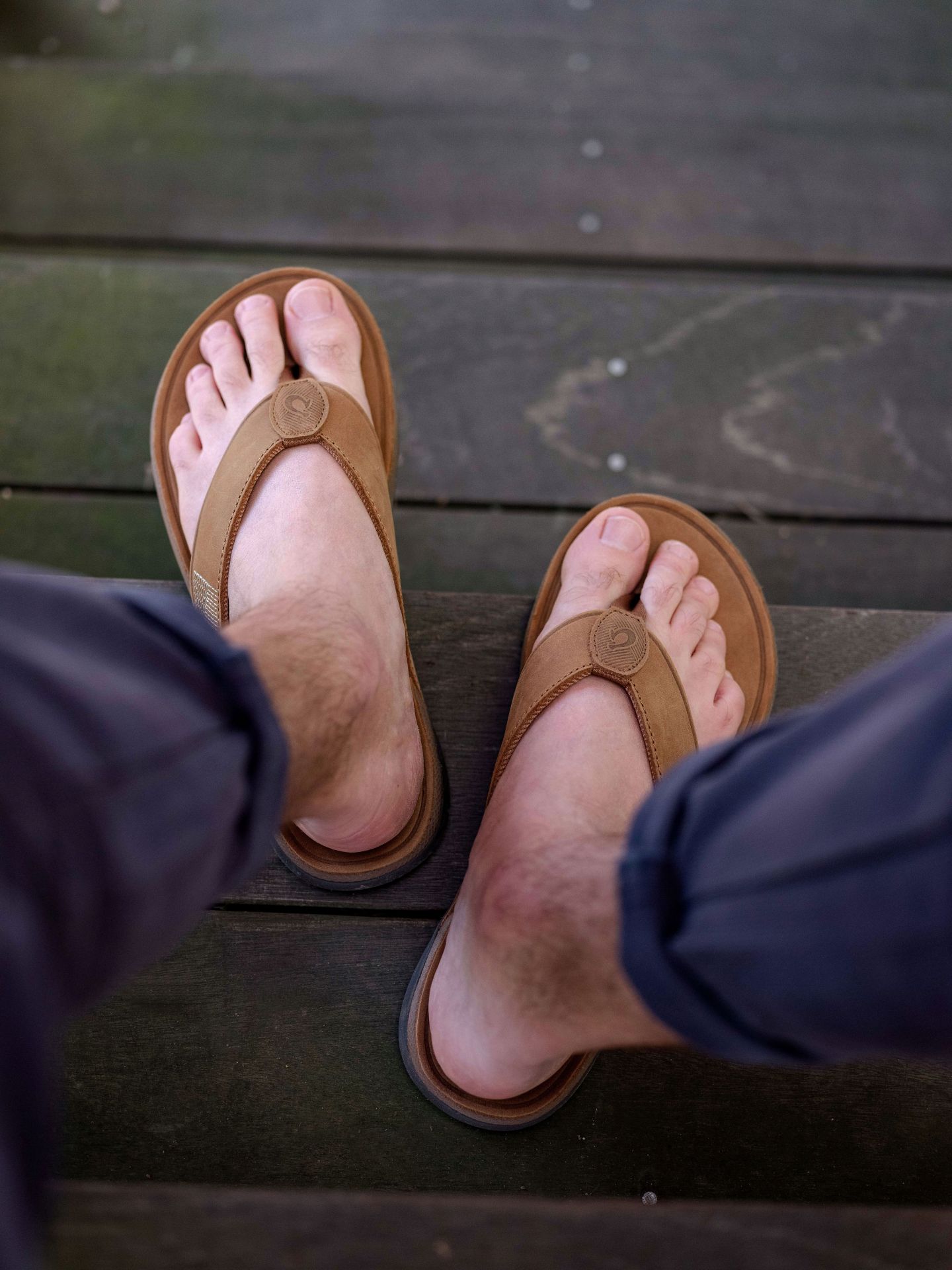 olukai tuahine sandals worn on feet
