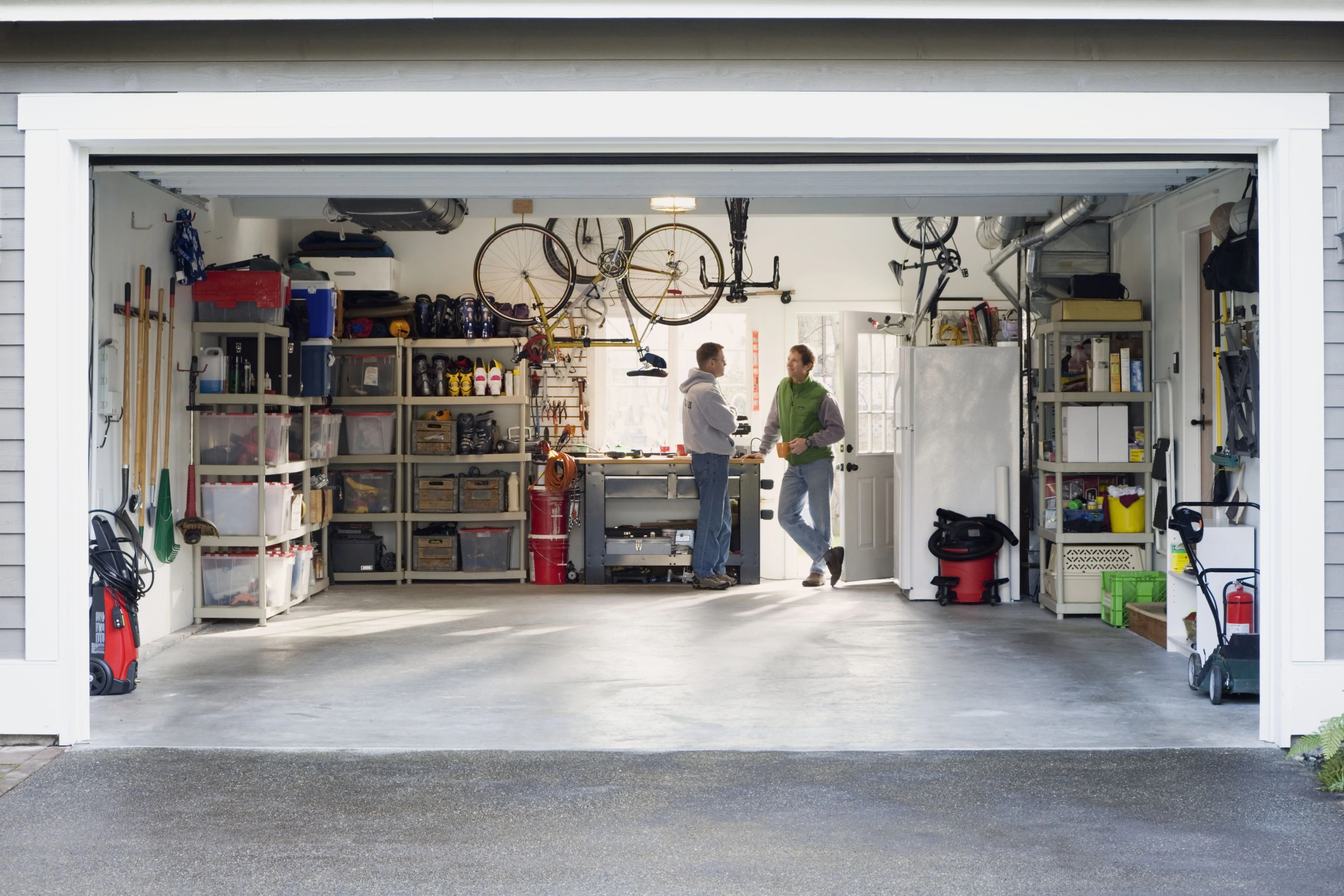 men talking in garage