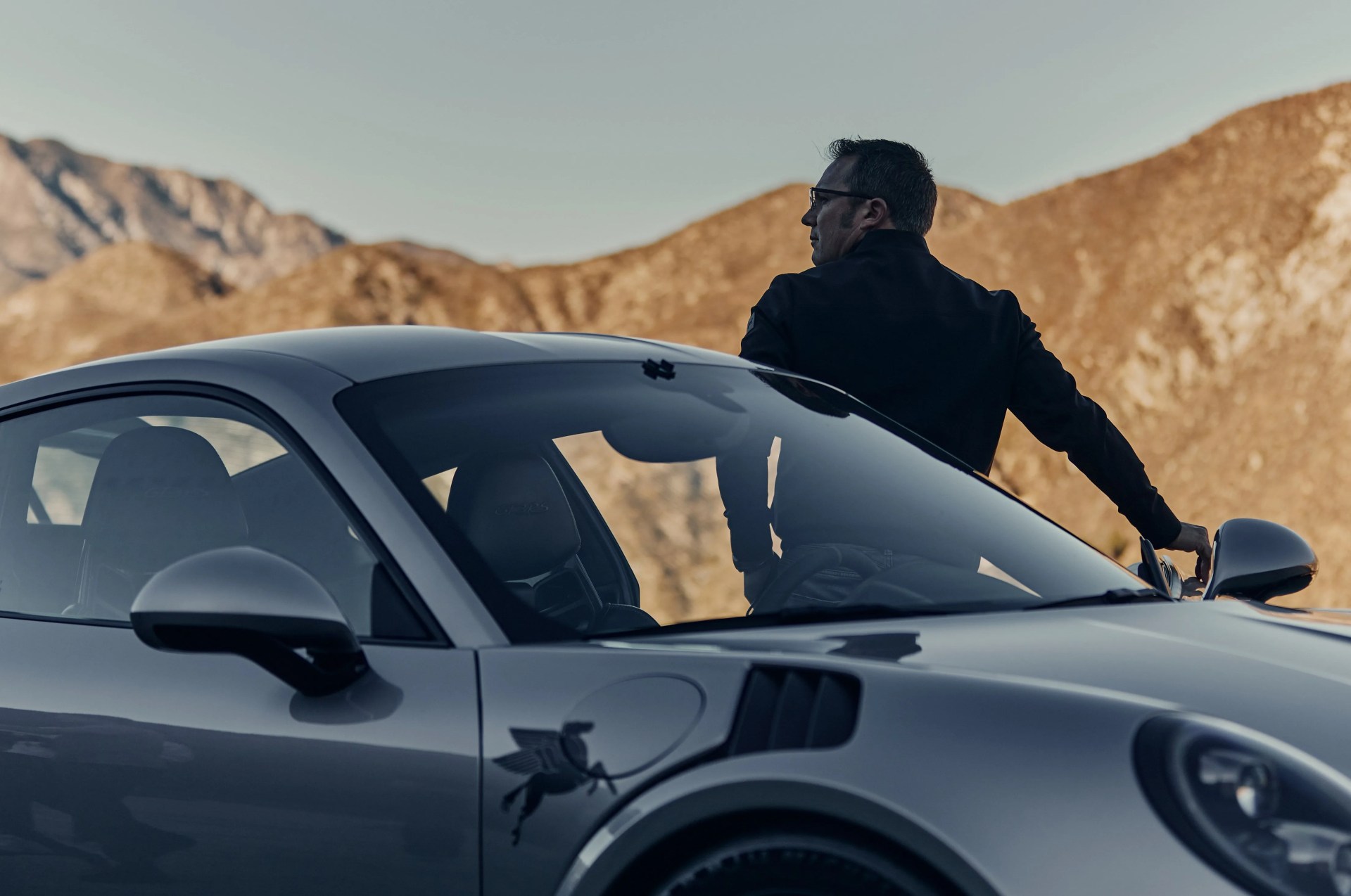 rod emery getting out of his porsche
