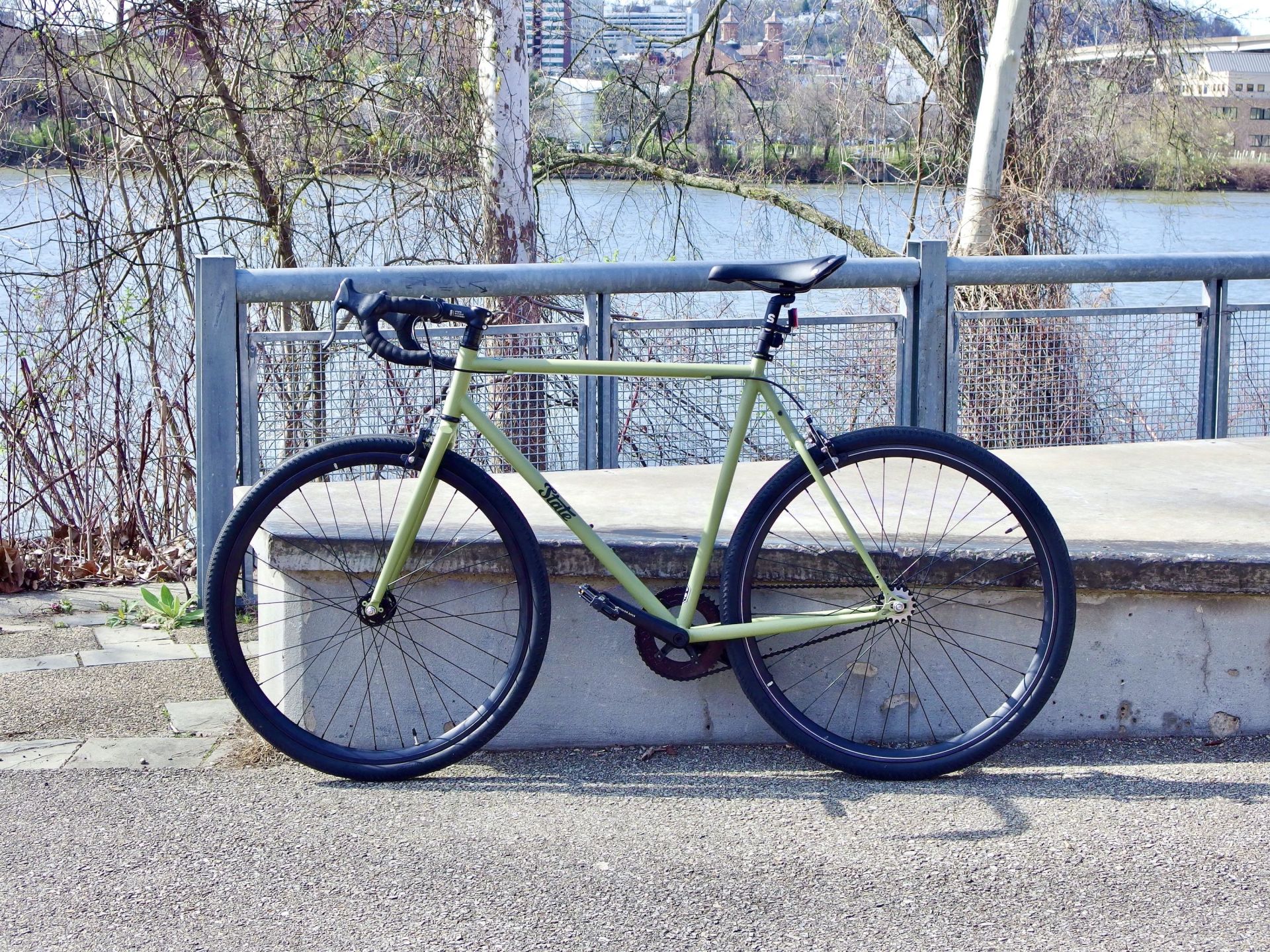 state biking sitting on a river trail