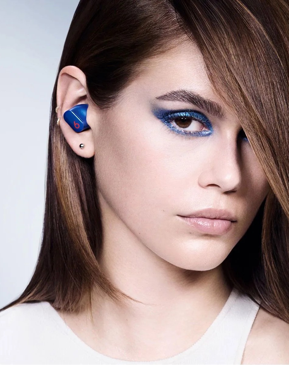 woman wearing beats studio buds true wireless noise cancelling earphones