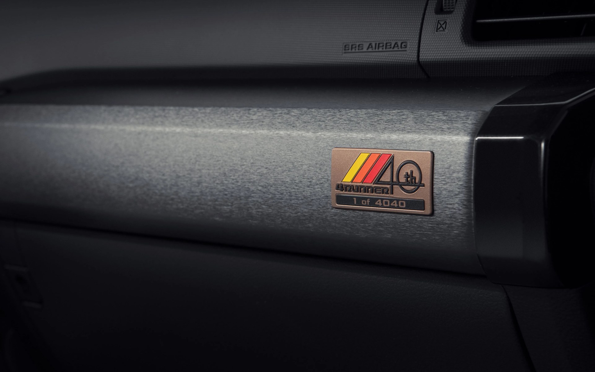 toyota 4runner 40th anniversary special edition badge on the passenger side dashboard