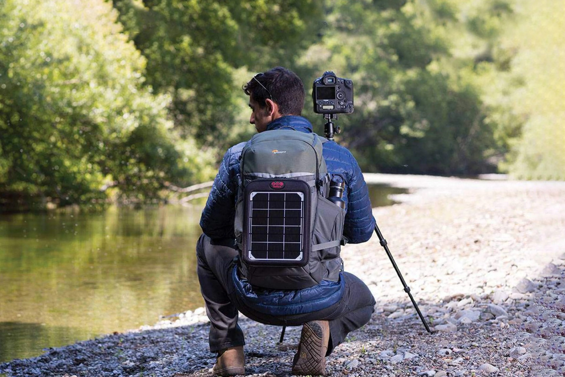 man photographing river with the flipside trek bp 350 aw
