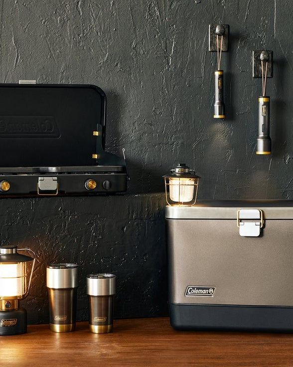 coleman the 1900 collection of steel belted hard cooler in multiple sizes, led lanterns and flashlights, a steel belted stainless steel wine bottle and tumblers and a 3 in 1 propane stove