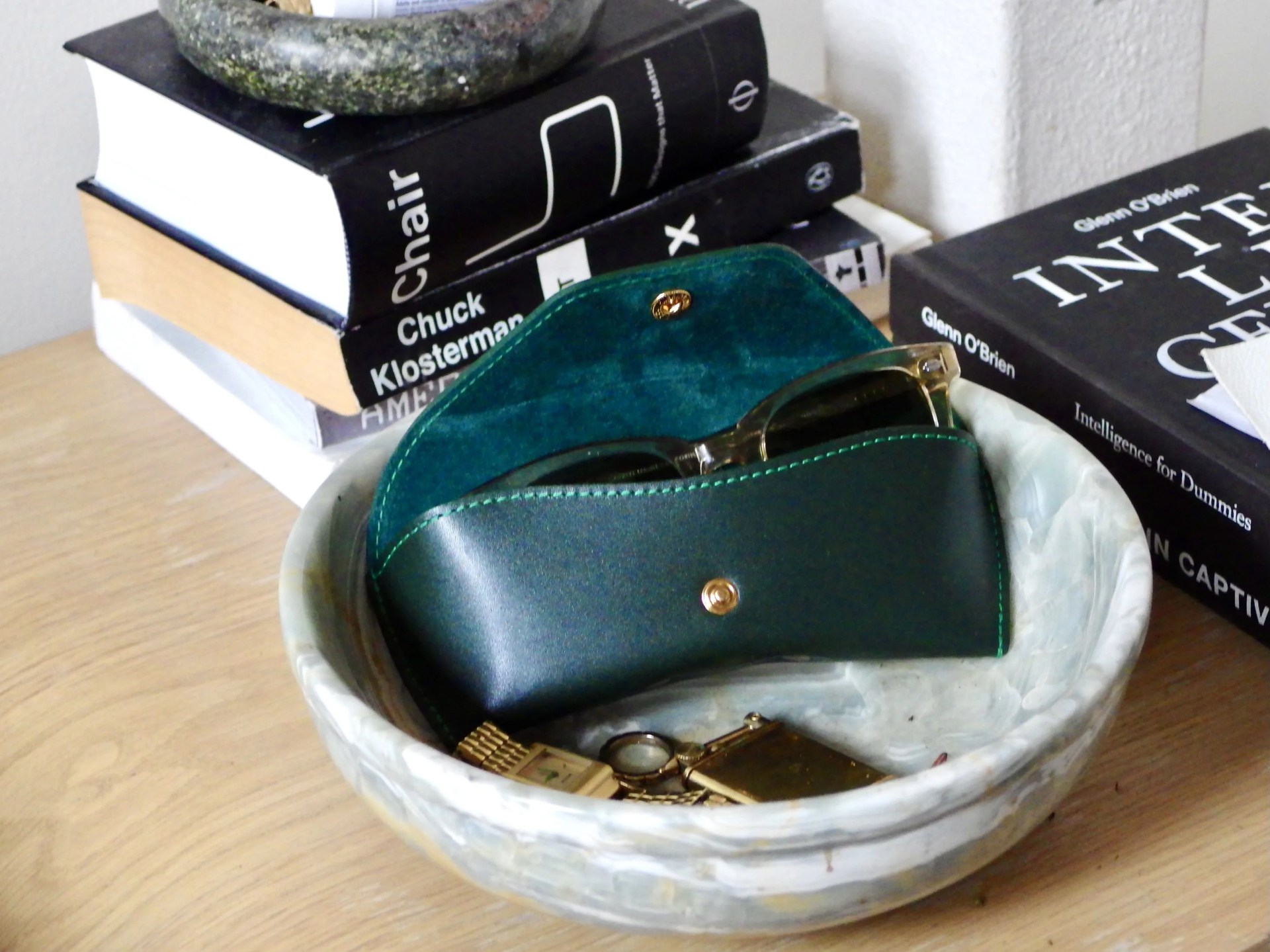 ettinger sunglass case sitting inside a marble bowl