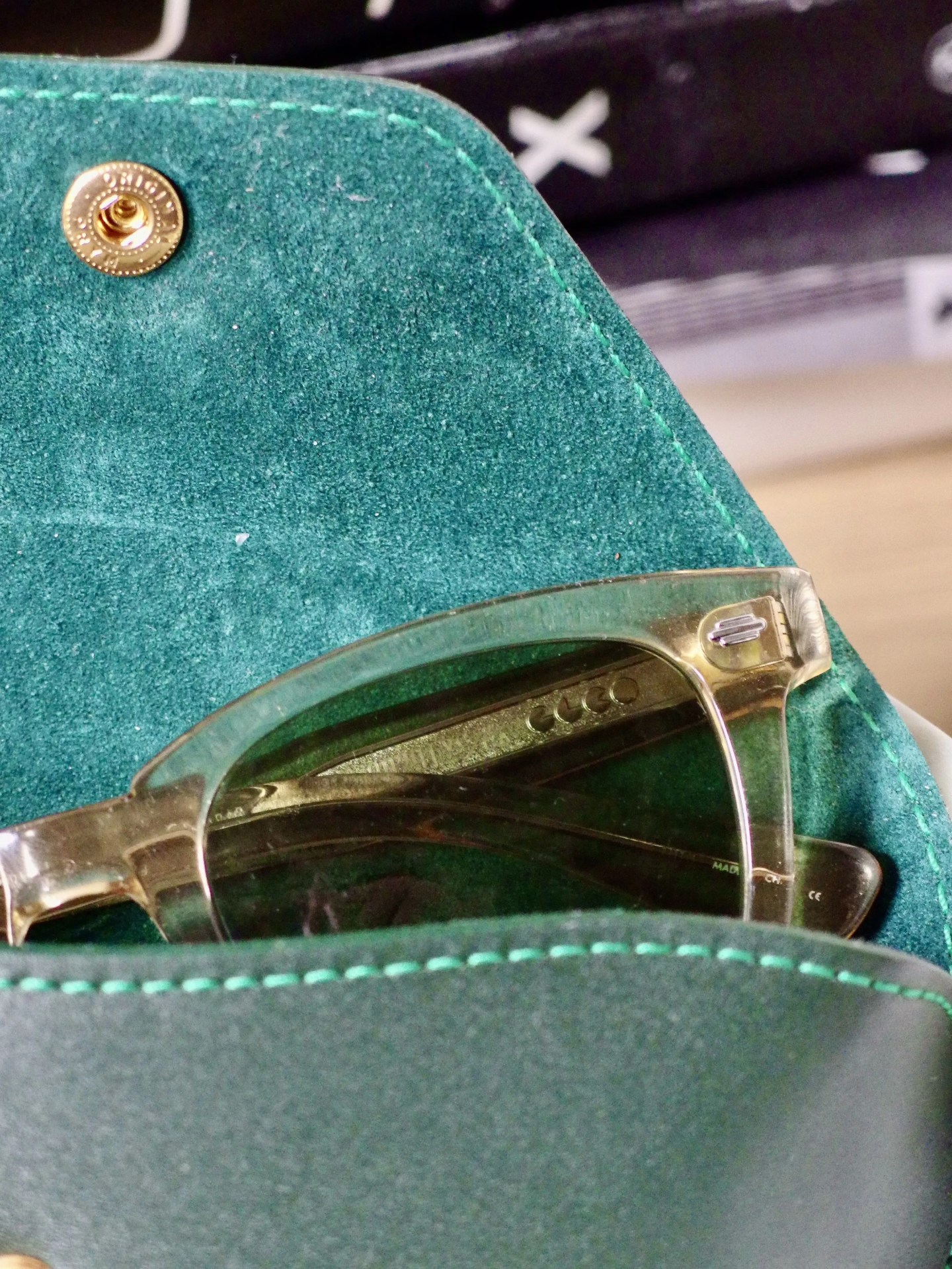 inside of an ettinger case with sunglasses poking out