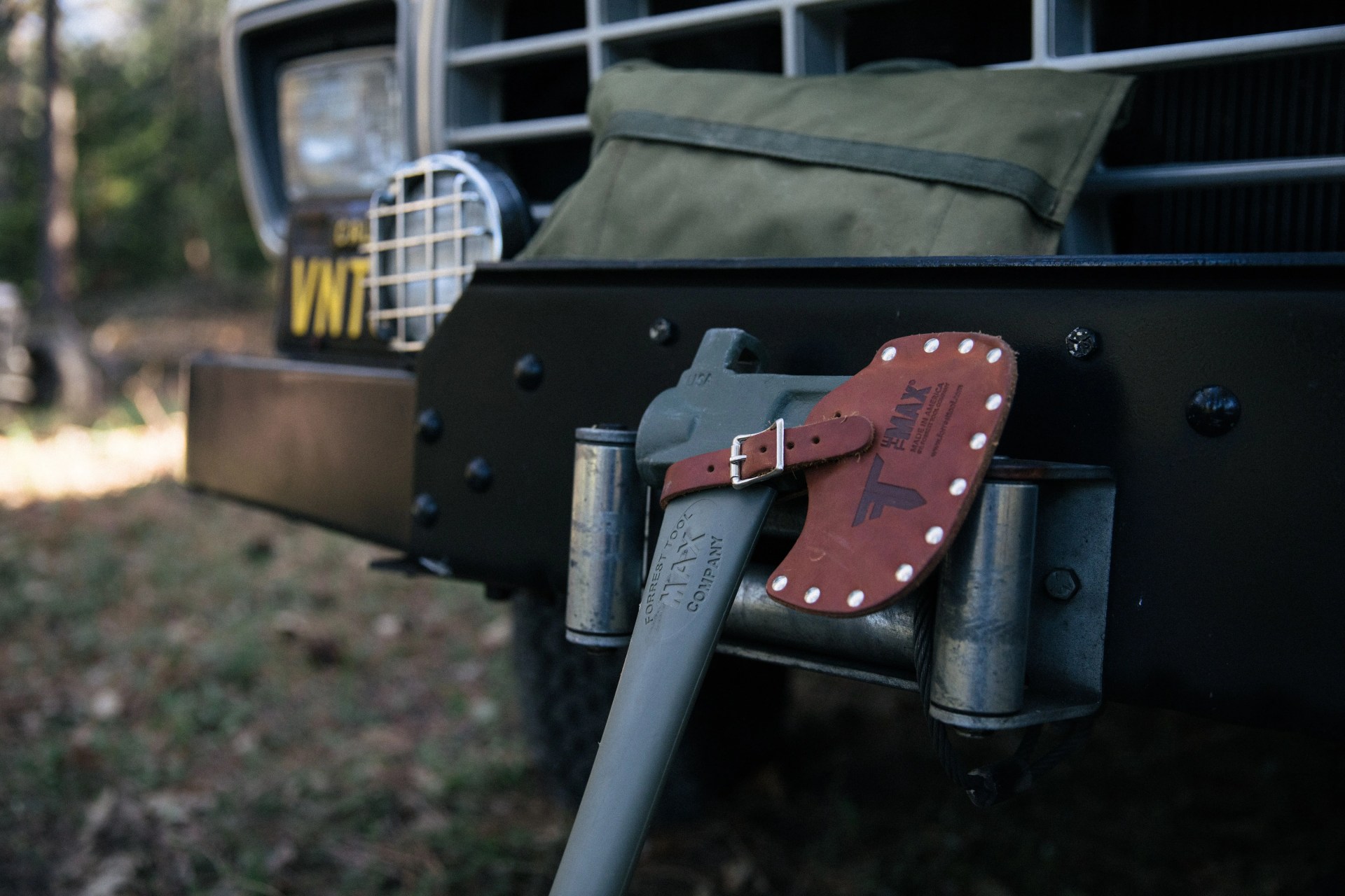 forrest tool company axe leaning against car