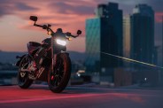 livewire s2 del mar electric motorcycle parked with city skyline in background