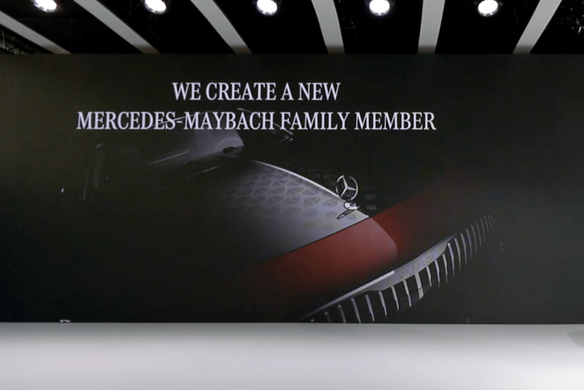 teaser photo of a new mercedes maybach vehicle at a presentation
