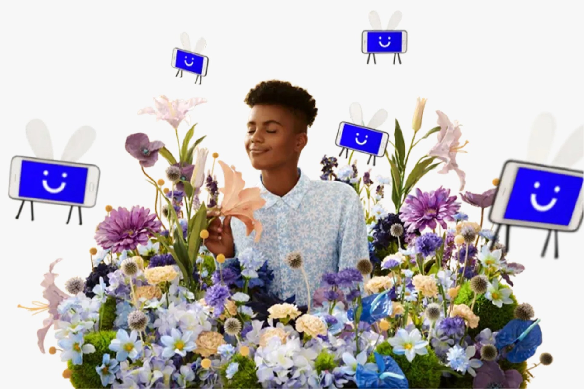 young man standing in flowers with visible phone illustrations flying around