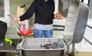 woman grilling on the pk300 grill