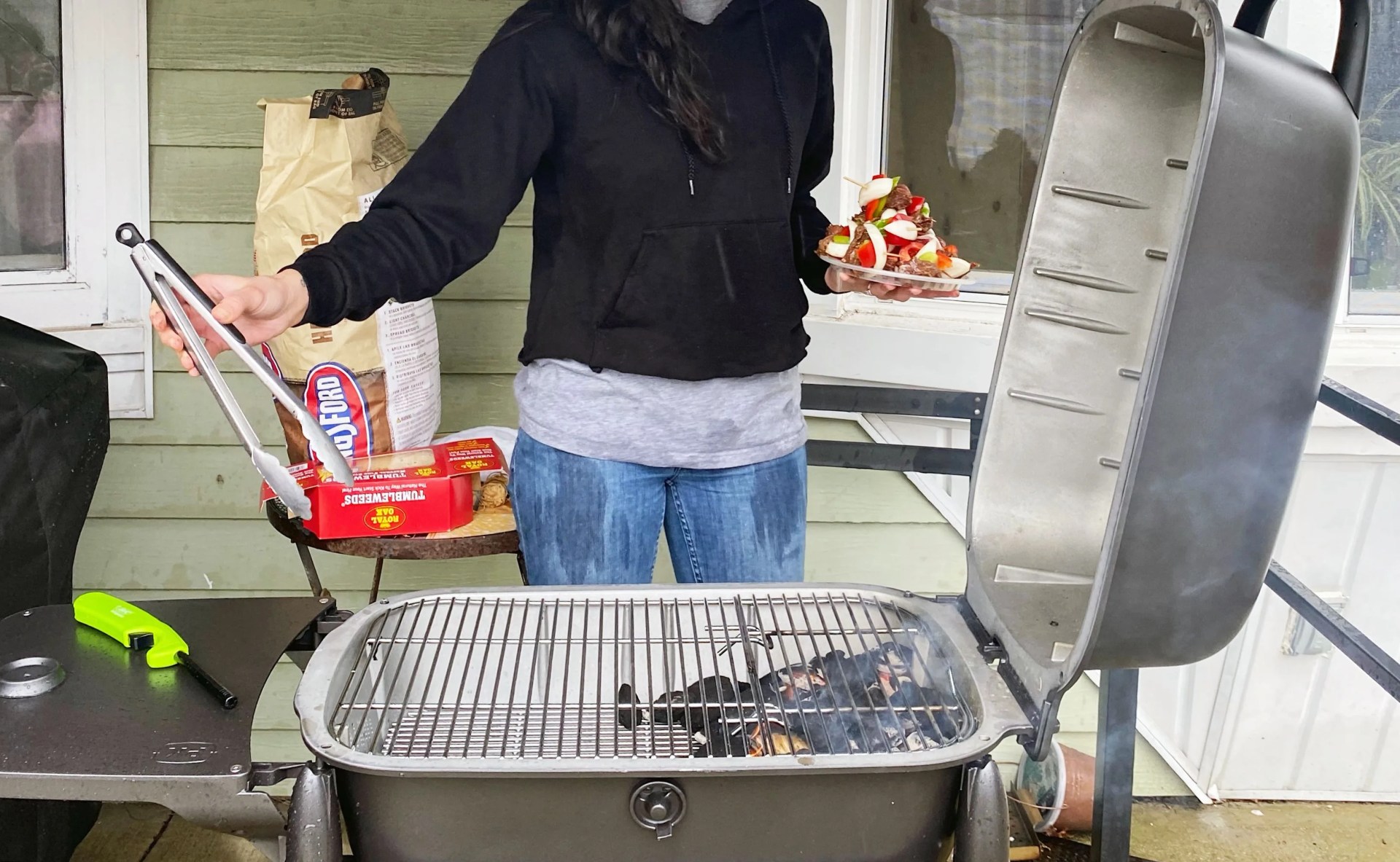 woman grilling on the pk300 grill