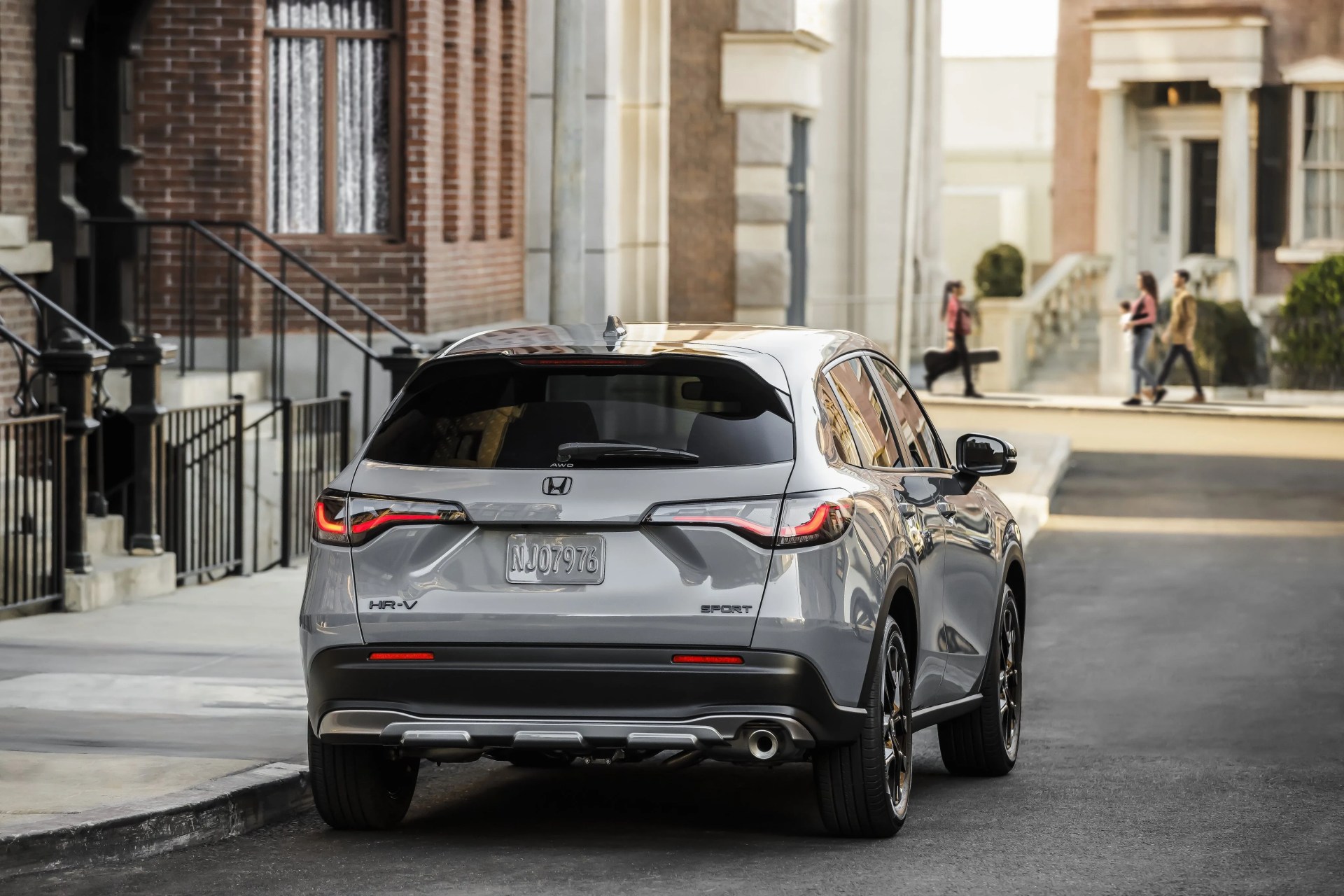 rear of 2023 honda hr v crossover parked on city street