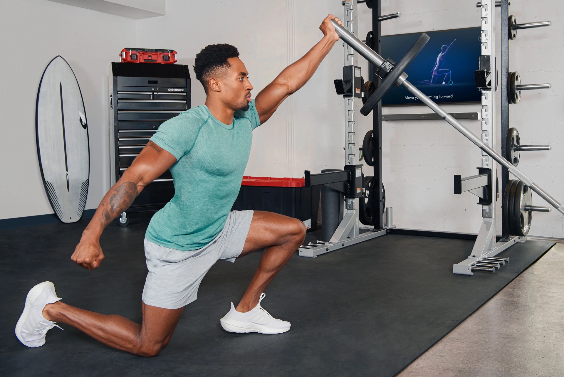 man working out in his garage gym