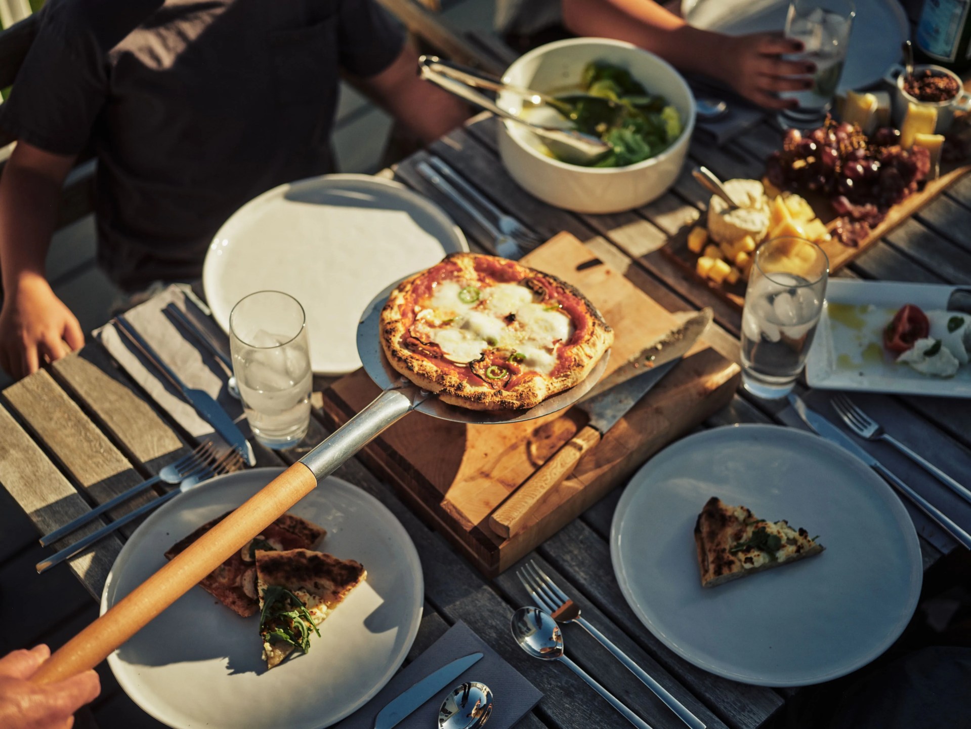 pizza being served to family