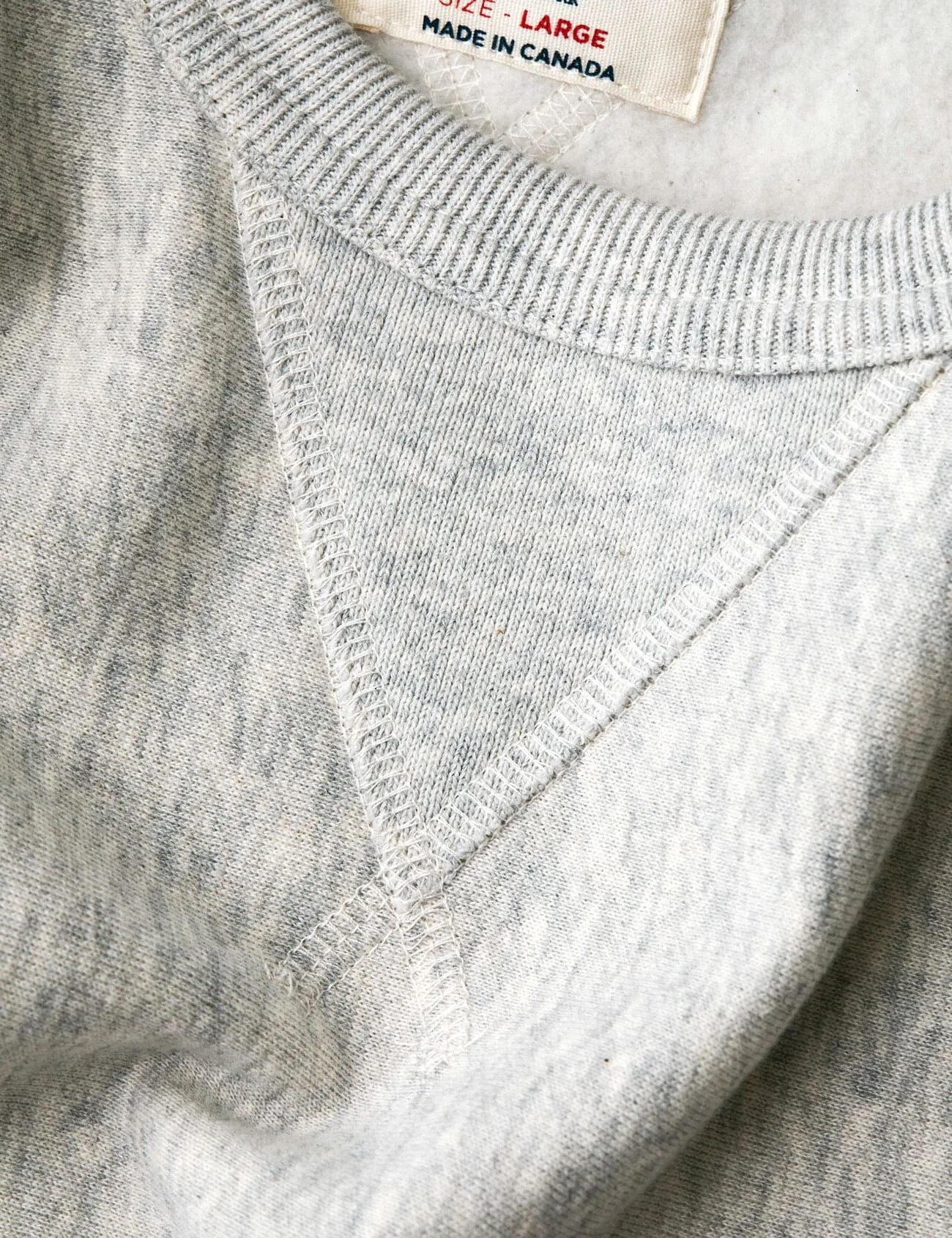 v stich on gray sweatshirt