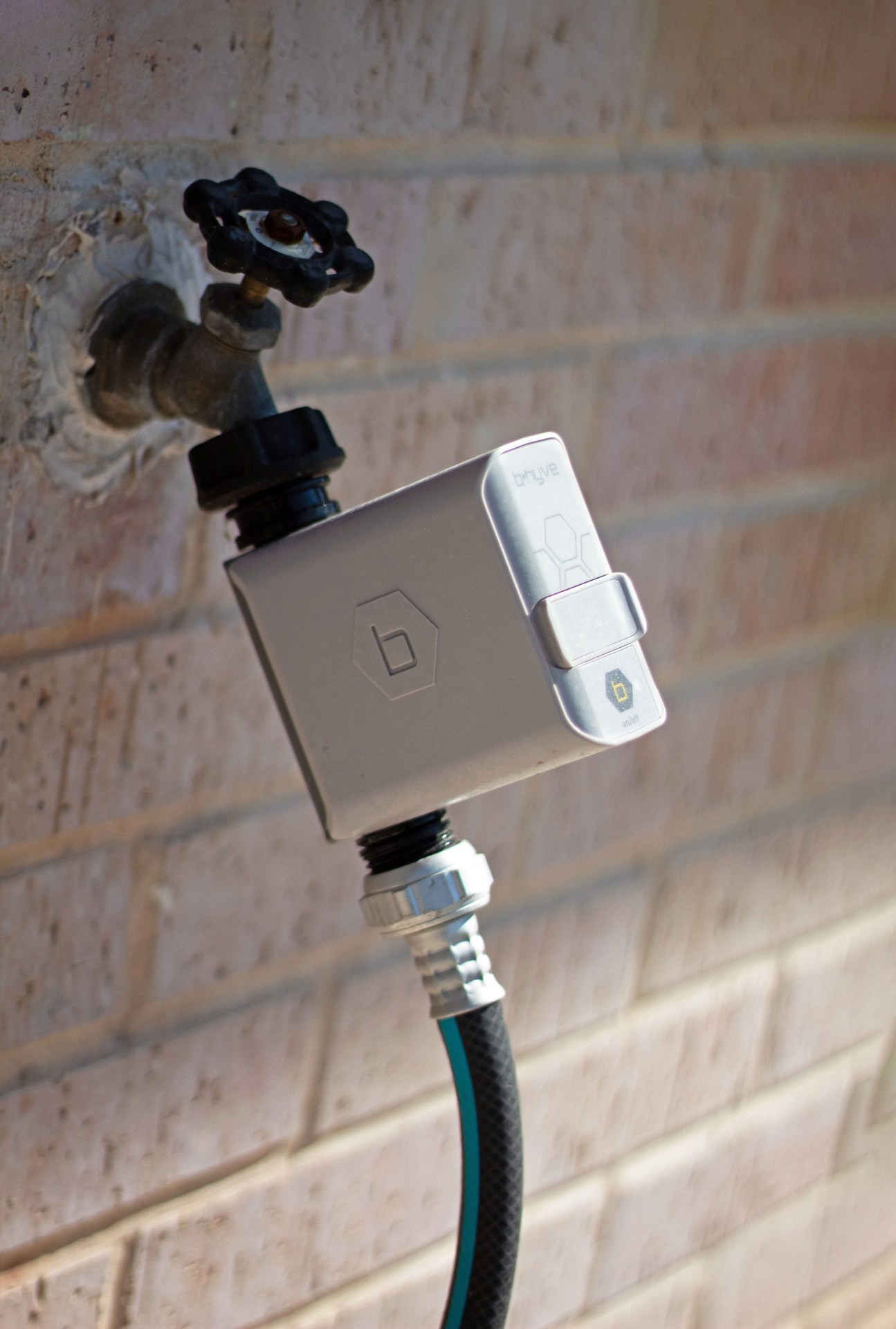 b hyve smart watering hose timer attached to hose