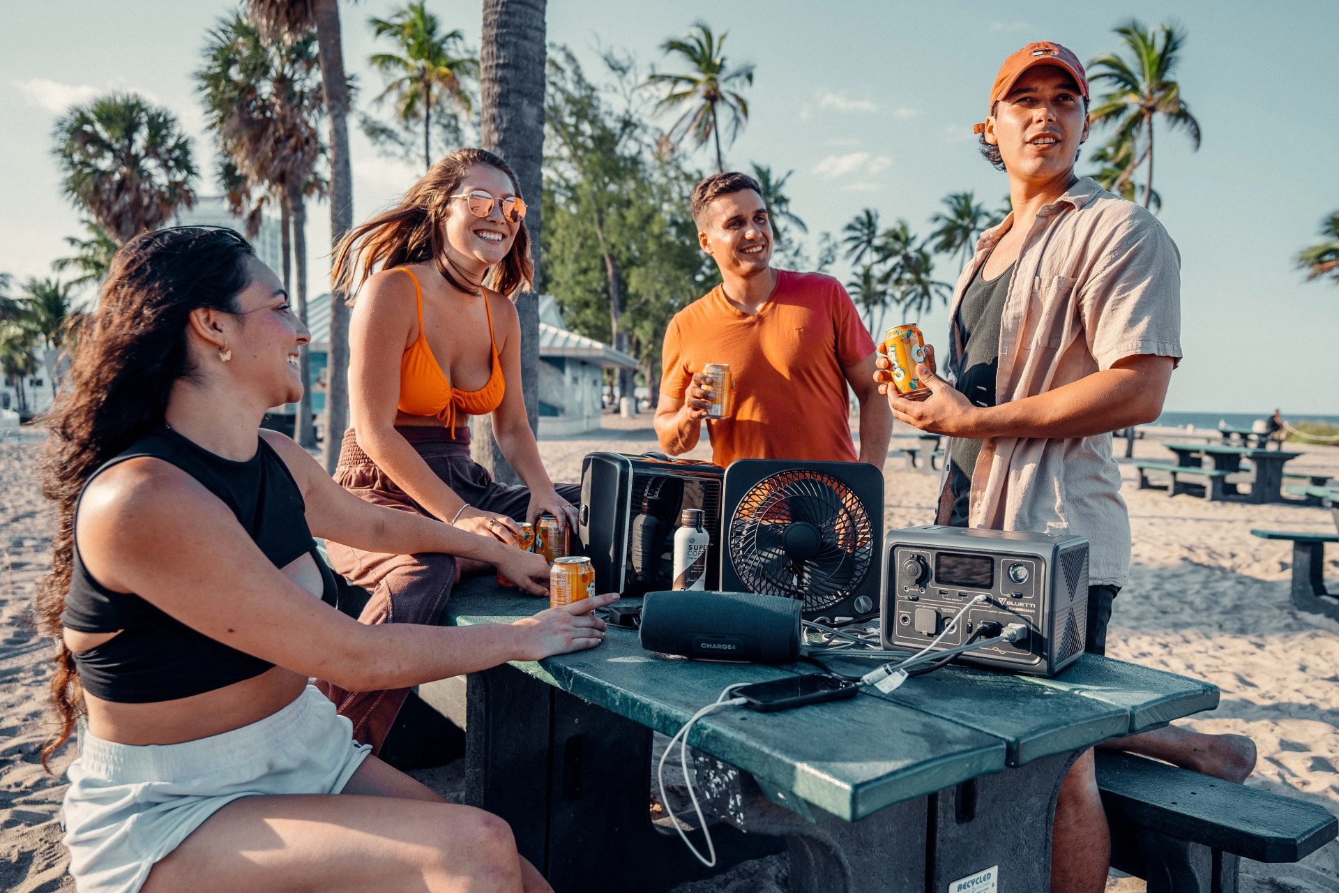 group of people at the beach using bluetti solar powered generator