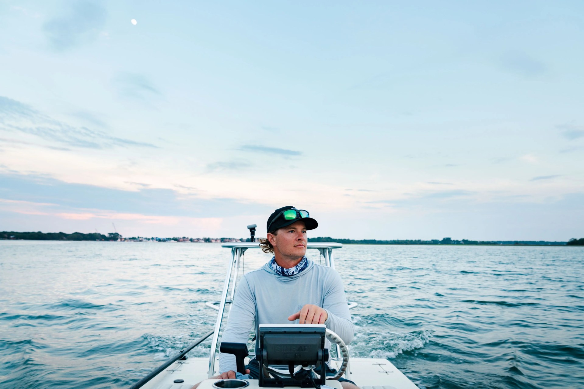 cole driving a boat to go fishing