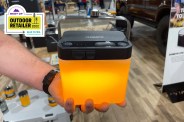 person holding an orange lantern