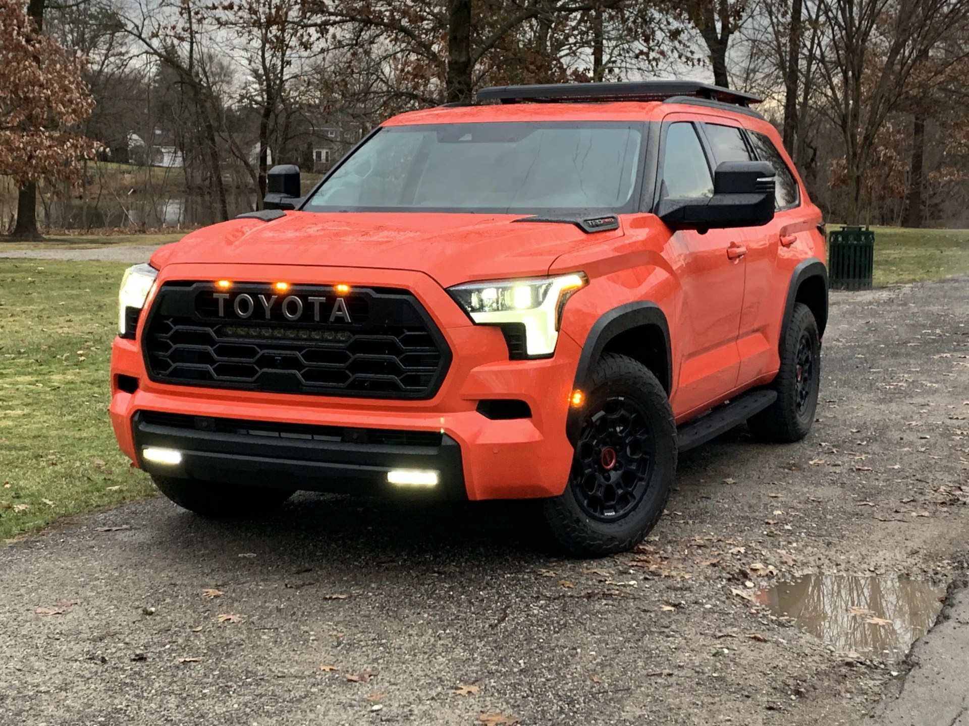 toyota sequoia 2023 parked in front of a park