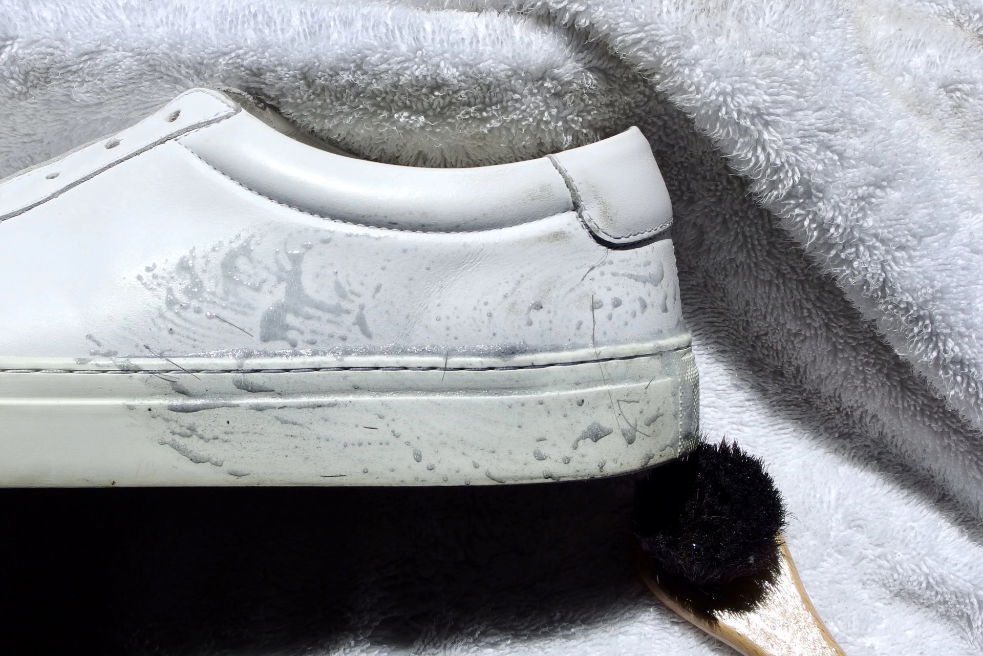 leather sneakers being cleaned