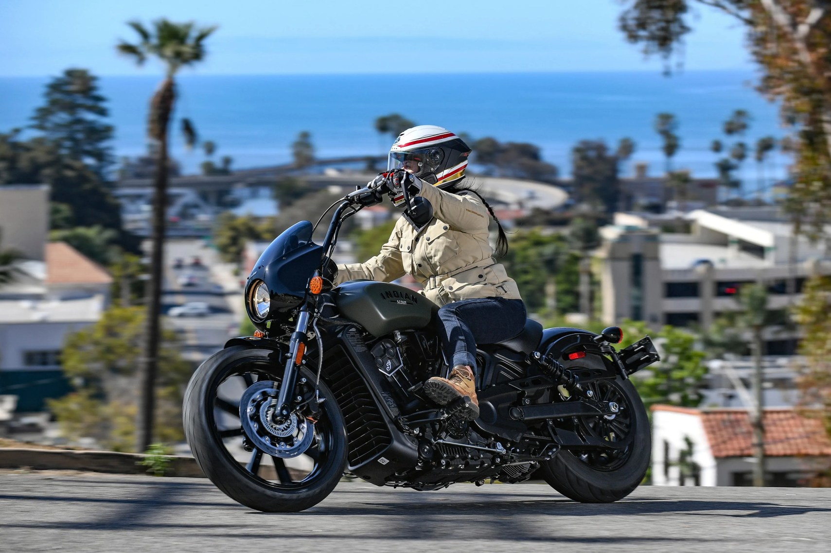 woman riding a 2022 indian scout rogue