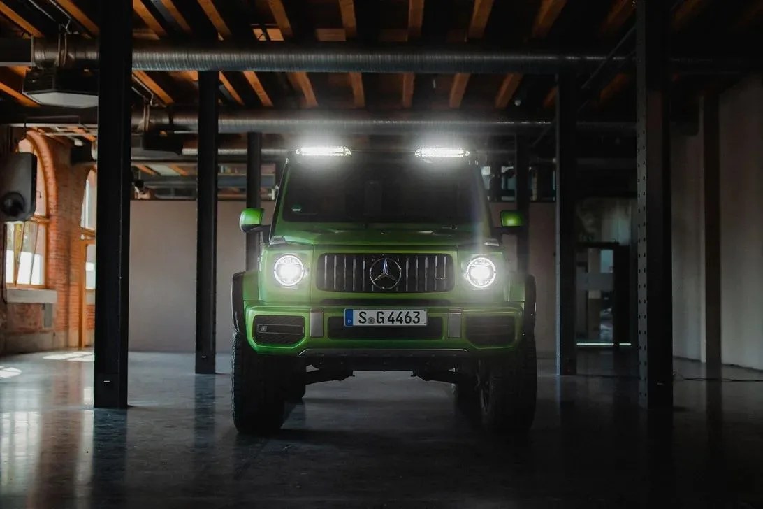 mercedes amg g63 4x4 squared parked in a warehouse with lights on