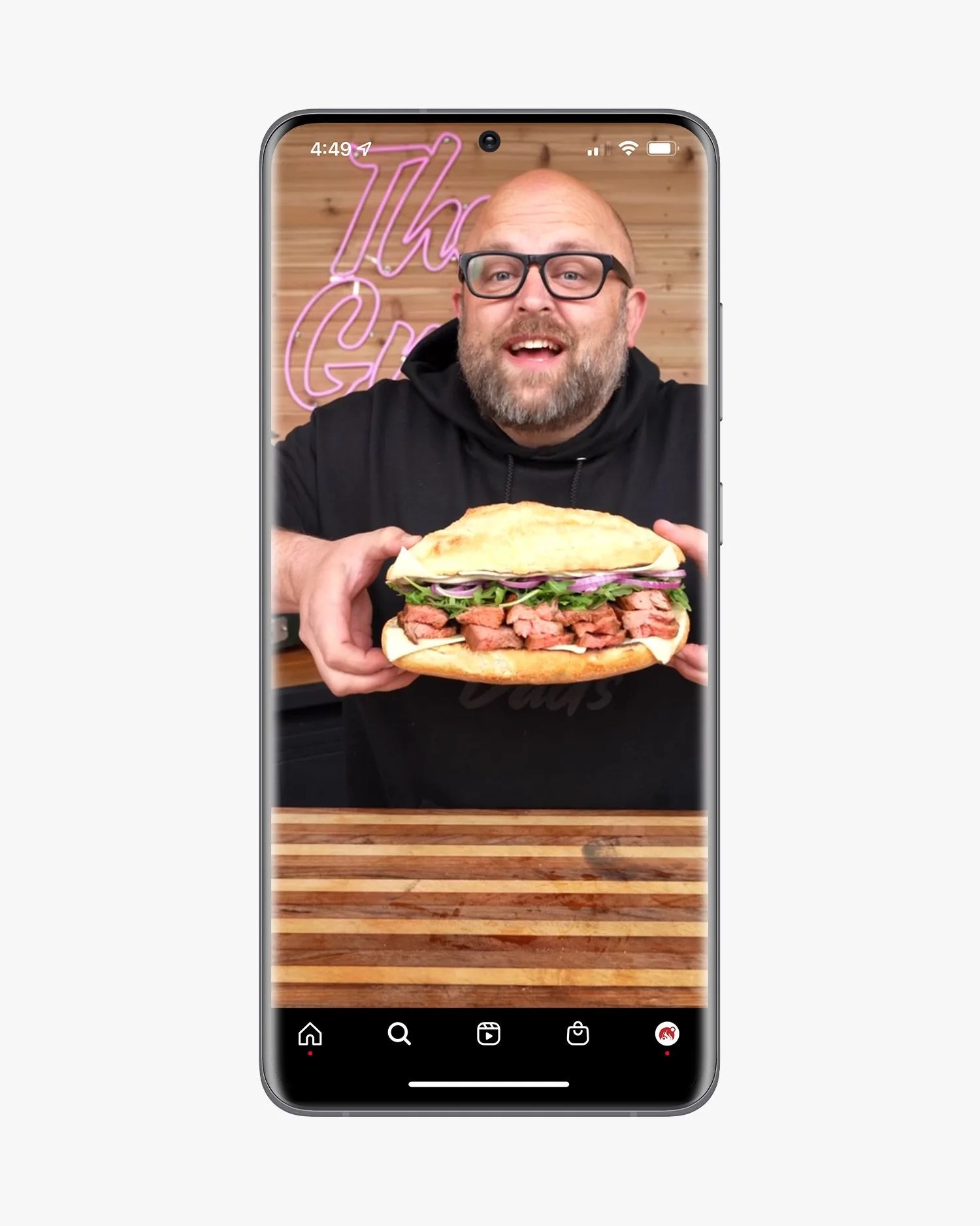 samsung phone showing wes anderson holding up a sandwich