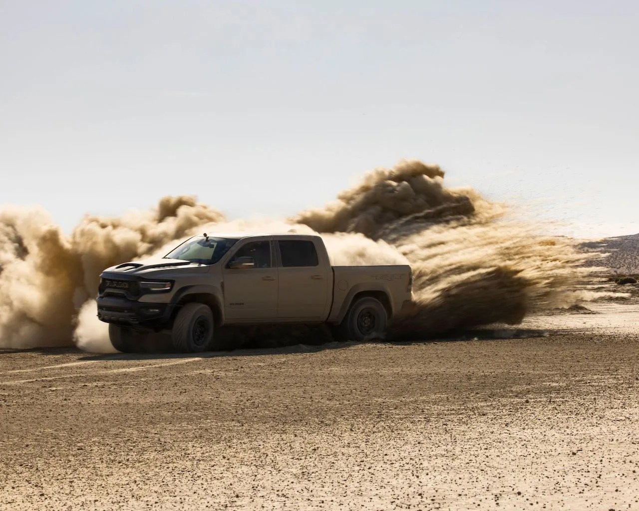 2022 ram 1500 trx sandblast driving through the sand